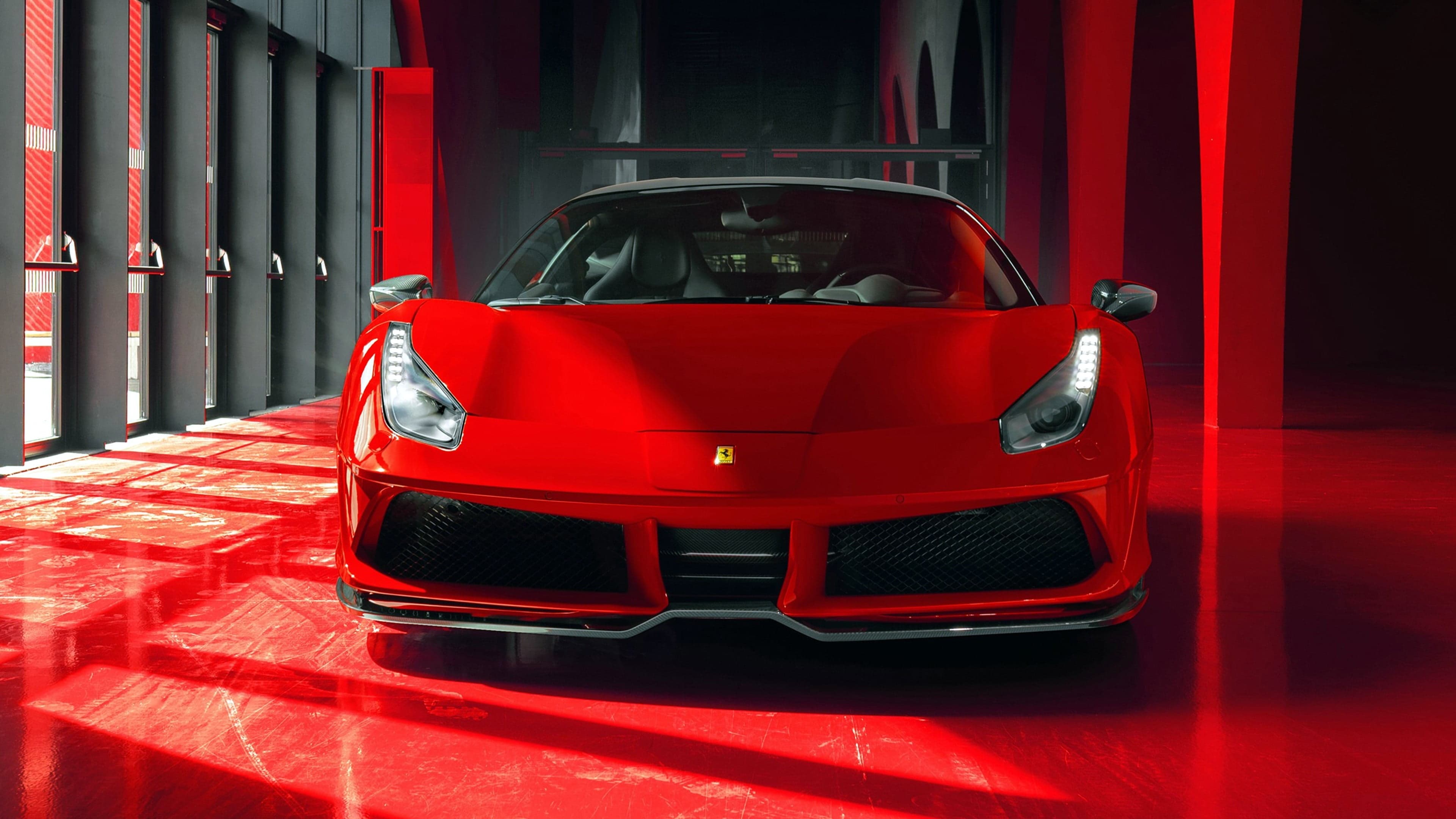 Red Ferrari 488 GTB in a dramatic showroom